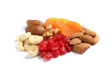 Different dried fruits and nuts on white background