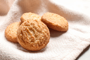 Tasty Danish butter cookies on color napkin, closeup