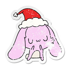 christmas distressed sticker cartoon of kawaii rabbit