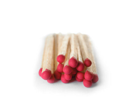 Pile of wooden matches on white background