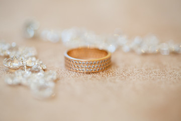 Gold wedding rings on the background of jewelry