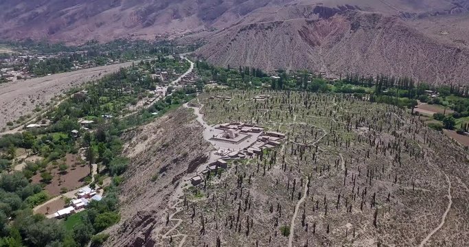 Beautiful landscape of the ruins of Pucara de Tilcara on a sunny day. Tilcara. Jujuy. Argentina. Aerial view zoom out