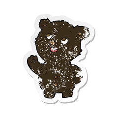 retro distressed sticker of a cartoon cute black bear cub