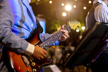 Obraz na płótnie Canvas Guitarist play music in the night time.