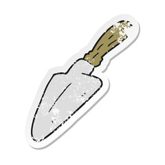 retro distressed sticker of a cartoon trowel