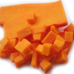 Fresh Butternut squash cut in pieces isolated on white background