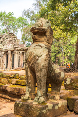 Khmer style Leo sculpture at the entrance to Ta Prohm temple, Cambodia