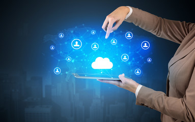 Hand holding tablet and showing staffs with global connectivity concept