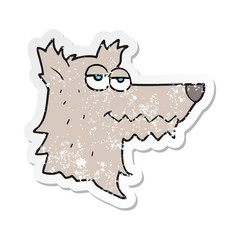retro distressed sticker of a cartoon wolf head