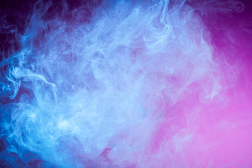 Blue cloud of smoke of  pink isolated background. Background from the smoke of vape.