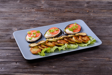 fried and fresh vegetables on a plate