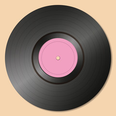 Old-fashioned vinyl record on a gray background.