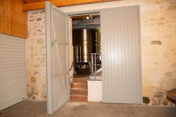 wood interior door entrance in wine vats inside winery