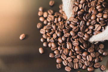 Isolated coffee beans reflected on surface for luxury sensation.