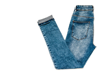 jeans in the background, blue jeans lie on a white background,