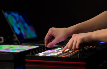 Fototapeta premium Dj hand remixing music on midi controller 