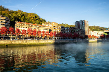 view of fog on nervion river at sunset in Bilbao city