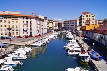 Fototapeta na wymiar Canal in the center of Livorno, Tuscany, Italy
