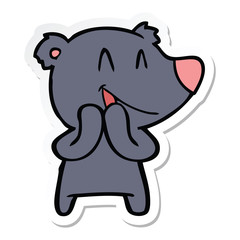 sticker of a laughing bear cartoon