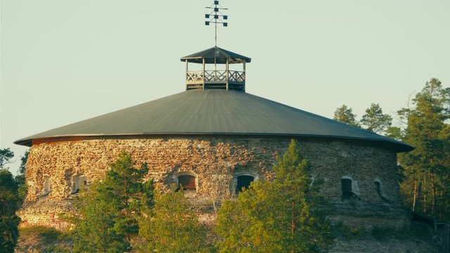 Aerial pan of historic coastal fortress with stone walls, firing lines for artillery and a lookout post on top, Fredriksborg fortress on V&auml;rmd&ouml; island in the Stockholm Archipelago, nowadays a museum.
