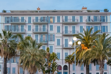 Fototapeta na wymiar Nice, old house at sunset, on the promenade des Anglais, French Riviera