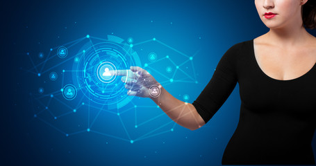 Woman touching hologram screen displaying keys and locks