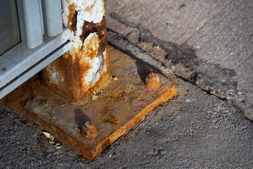 Rusty nut bolt in a street mount