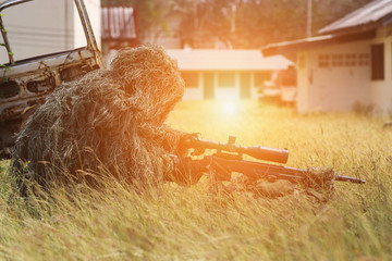 Soldiers in camouflage outfits, sniper guns used to shoot from a distance.