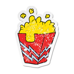 distressed sticker of a cartoon box of popcorn
