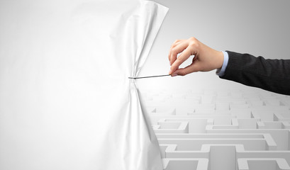 Hand pulling paper curtain, changing scene concept