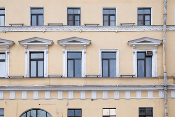  windows and details on an exterior of the building.