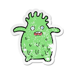 retro distressed sticker of a cartoon funny slime monster