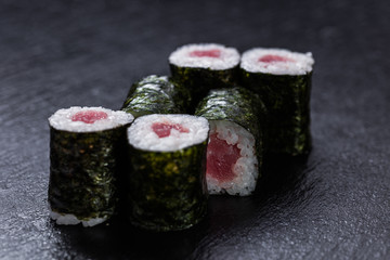 Tuna maki arranged on slate plate