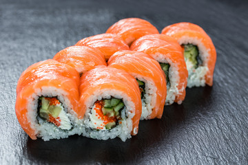 Big portion of philadelphia makizushi roll with salmon