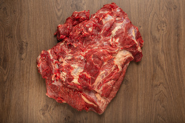 Raw fresh beef on a wooden background, catalog.