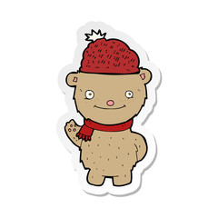 sticker of a cartoon bear in hat