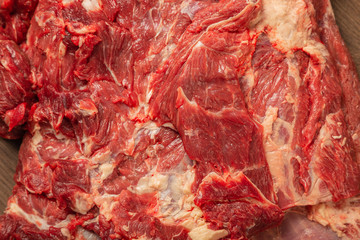 Raw fresh beef on a wooden background, catalog.