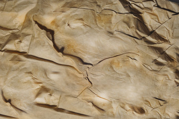 Texture of crumpled recycled brown paper