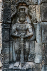 Fototapeta na wymiar Relief of the guard in Banteay Kdey temple, Cambodia
