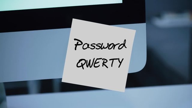 Simple, easy password. Qwerty. 1234567. Computer security. Account hacking. Password on the monitor. Handwritten text written with a marker. Color sticker. A message for an employee, a colleague
