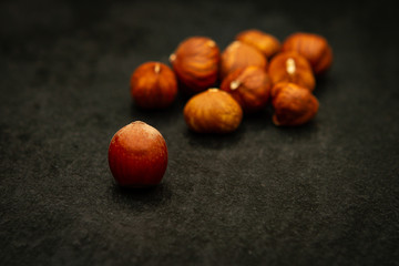 close-up of hazelnuts over a black background