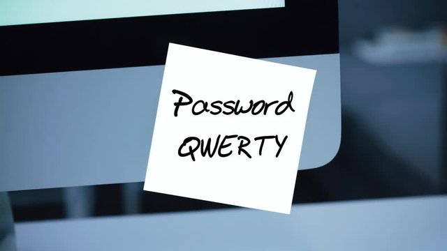 Simple, easy password. Qwerty. 1234567. Computer security. Account hacking. Password on the monitor. Handwritten text written with a marker. Color sticker. A message for an employee, a colleague