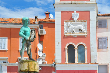 Croatia, Istria, Rovinj, The clock Tower and the Boy with the fish Fountain on Main Square, Rovinj.