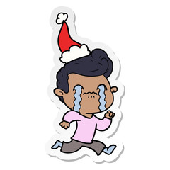 sticker cartoon of a man crying wearing santa hat