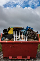 rubbish skip full discarded and broken items
