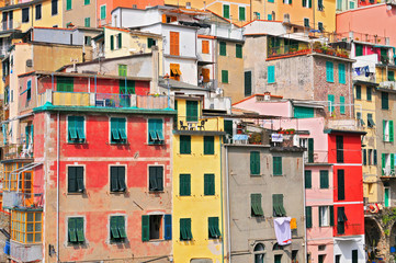 Fototapeta na wymiar The colorful houses of the fishing port of Riomaggiore, Cinque Terre National Park, Liguria, Italy.