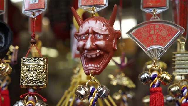 Close up of a demon mask in a gift shop, Japan.
