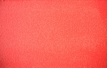 Living Coral color painted concrete wall texture backgrond