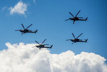 Fototapeta na wymiar Group of military helicopters Mi-28 in the sky