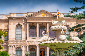 Obraz premium Ornate carved swan fountain in pond of formal gardens at Dolmabahce Palace Istanbul Turkey.